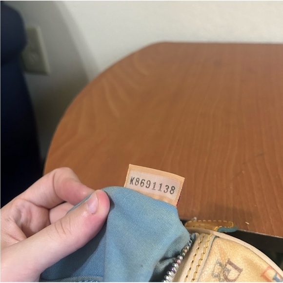 Dooney & Bourke
Cream Tan Shoulder
Bag Leather Trim Coated
Monogram Rainbow - Picture 9 of 10